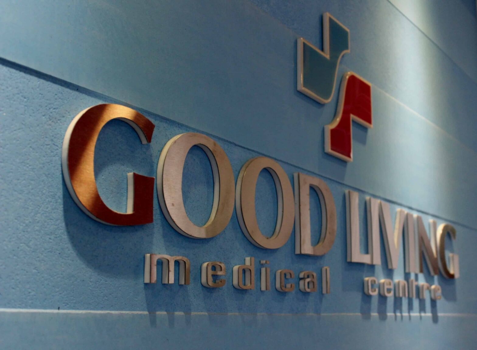 Picture of Good Living Medical Centre, Dubai logo on the blue wall